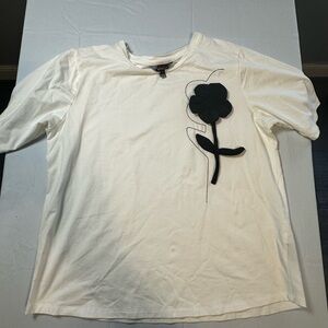 Elegant White Tee with Black Floral Accent